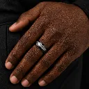 black-ceramic-ring-with-white-carbon-fiber-inlay-on-hand.webp