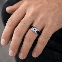 tungsten-ring-with-blue-carbon-fiber-inlay-stone-on-hand.webp