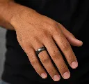 8mm-black-tungsten-brushed-finish-ring-domed-on-hand.webp
