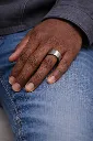 brushed-finish-flat-tungsten-carbide-ring-on-hand-2.webp