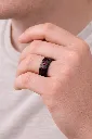 black-ceramic-ring-with-red-stone-inlay-carbon-fiber-on-hand.webp