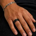 black-ceramic-carbon-fiber-ring-on-hand.webp